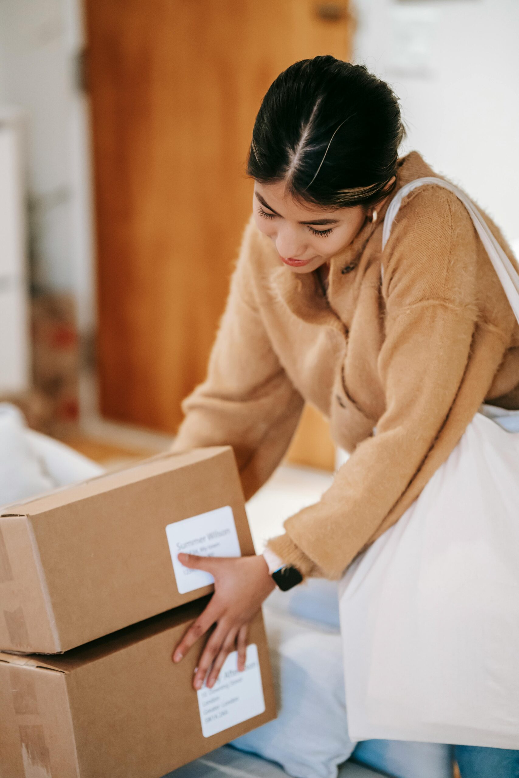 Customer receiving carton boxes from AliExpress order at home in Korea