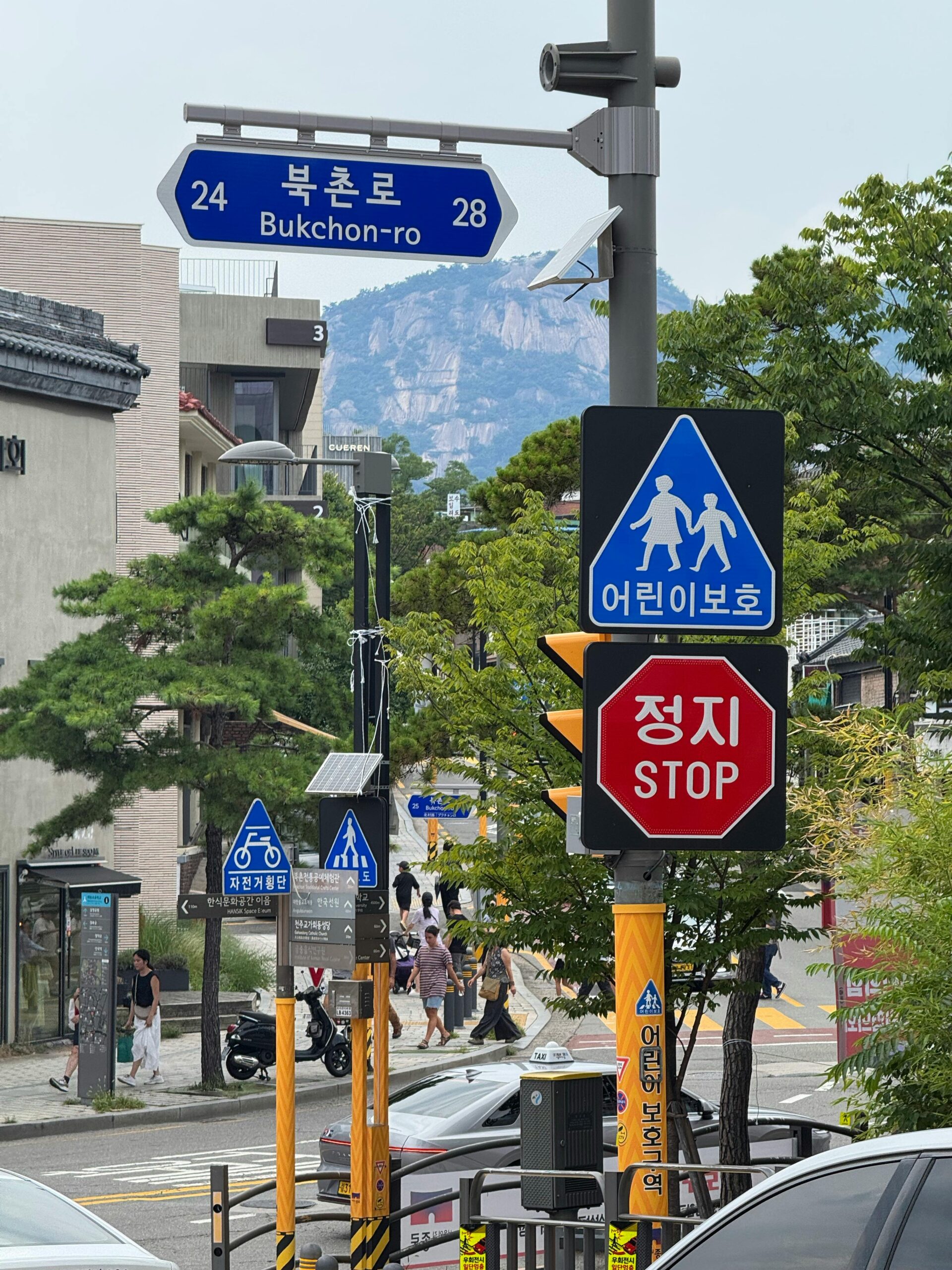 Bukchon Hanok Village street scene in Seoul where road name and lot number addresses coexist