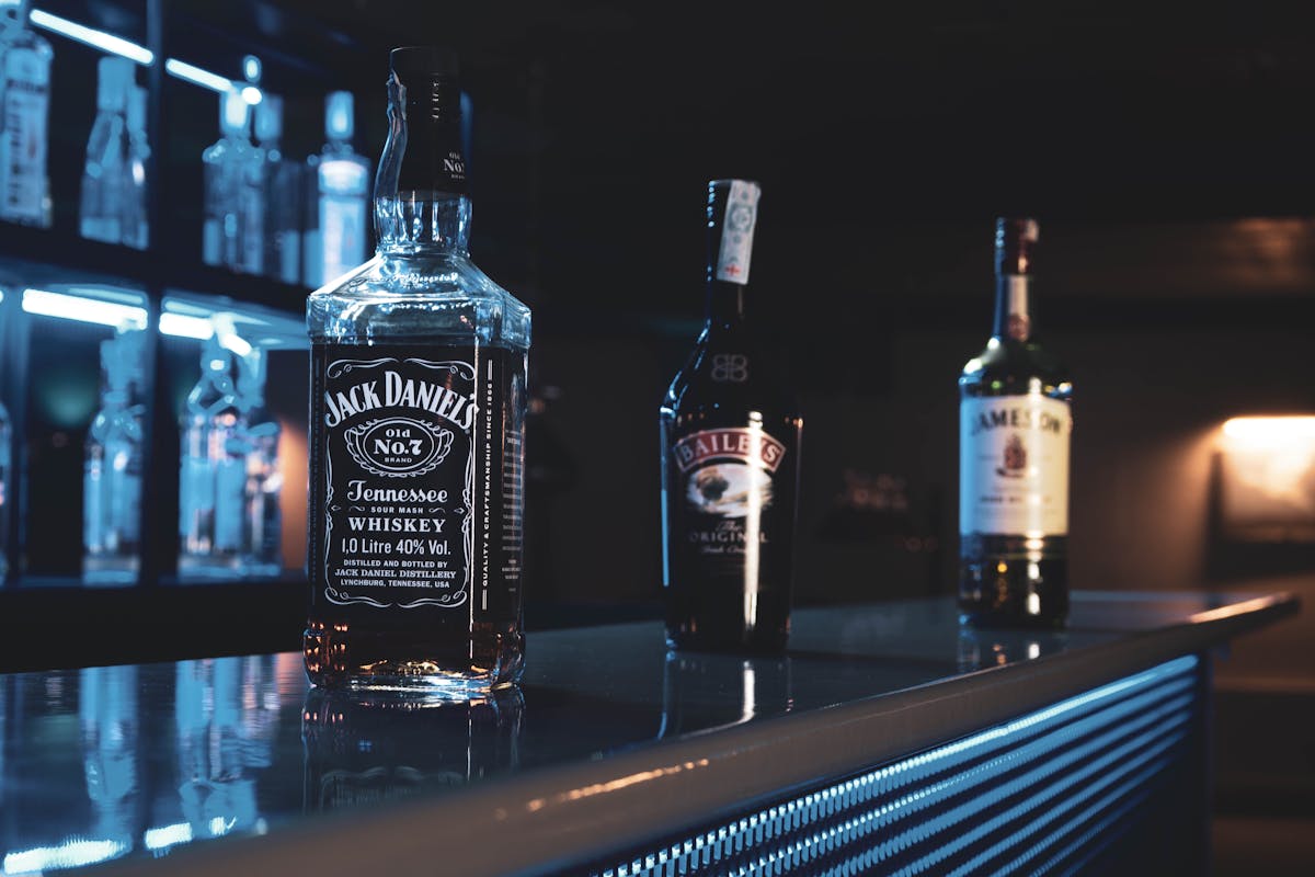 Bar display showing imported whiskey bottles with high excise tax in Korea