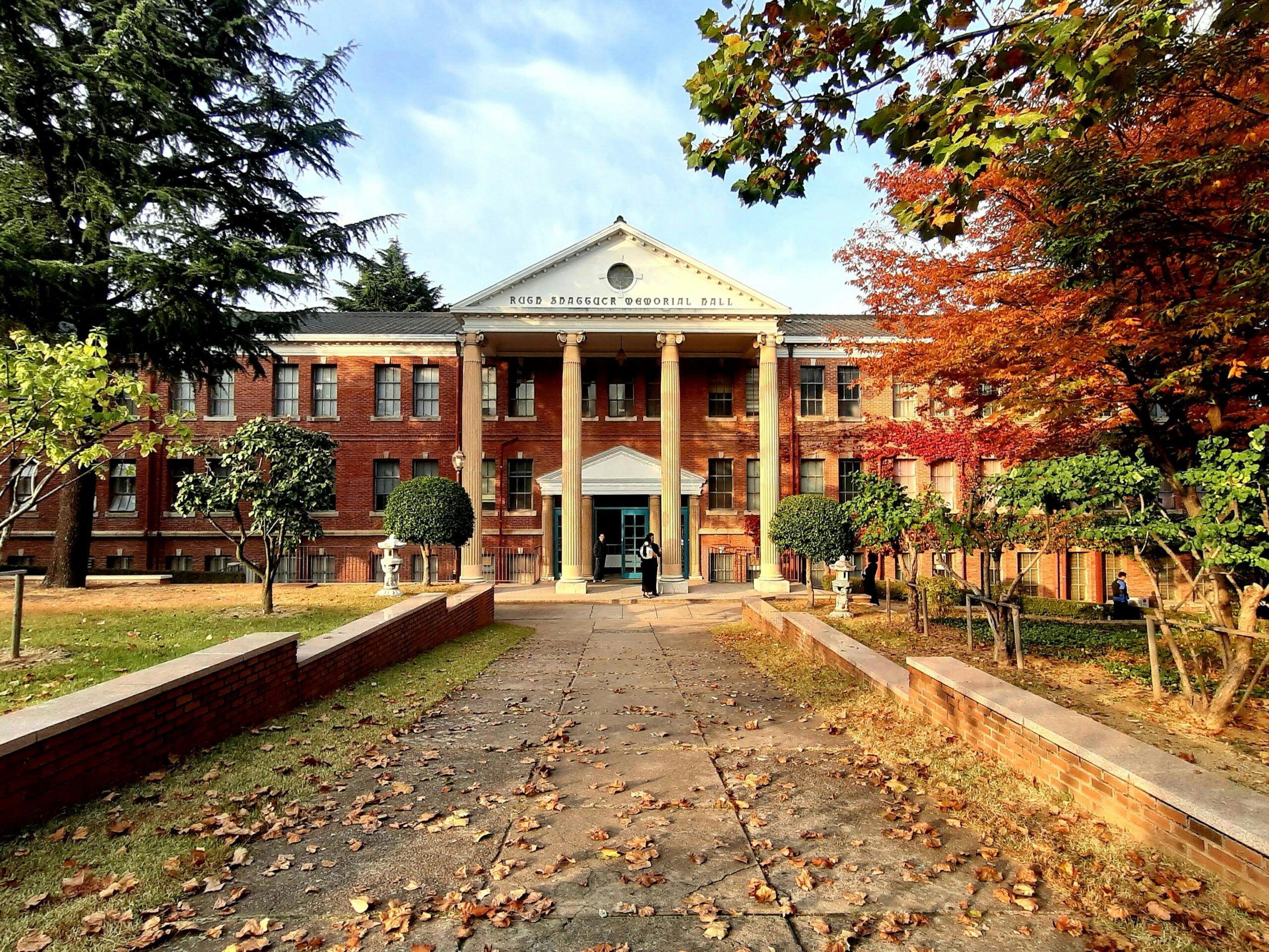 Korea international school building with autumn foliage