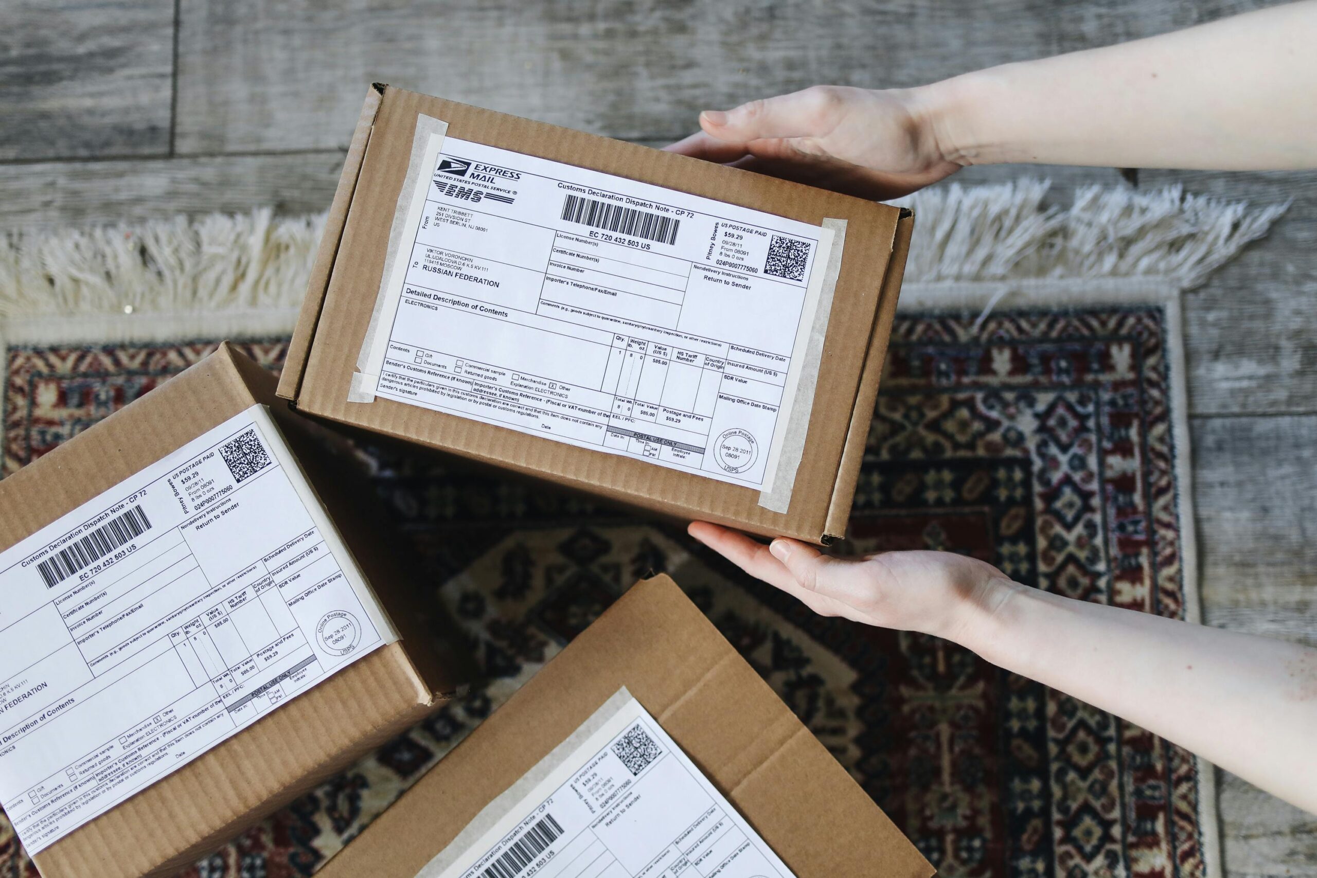 Korea reshipping delivery service box being sealed for overseas shipping