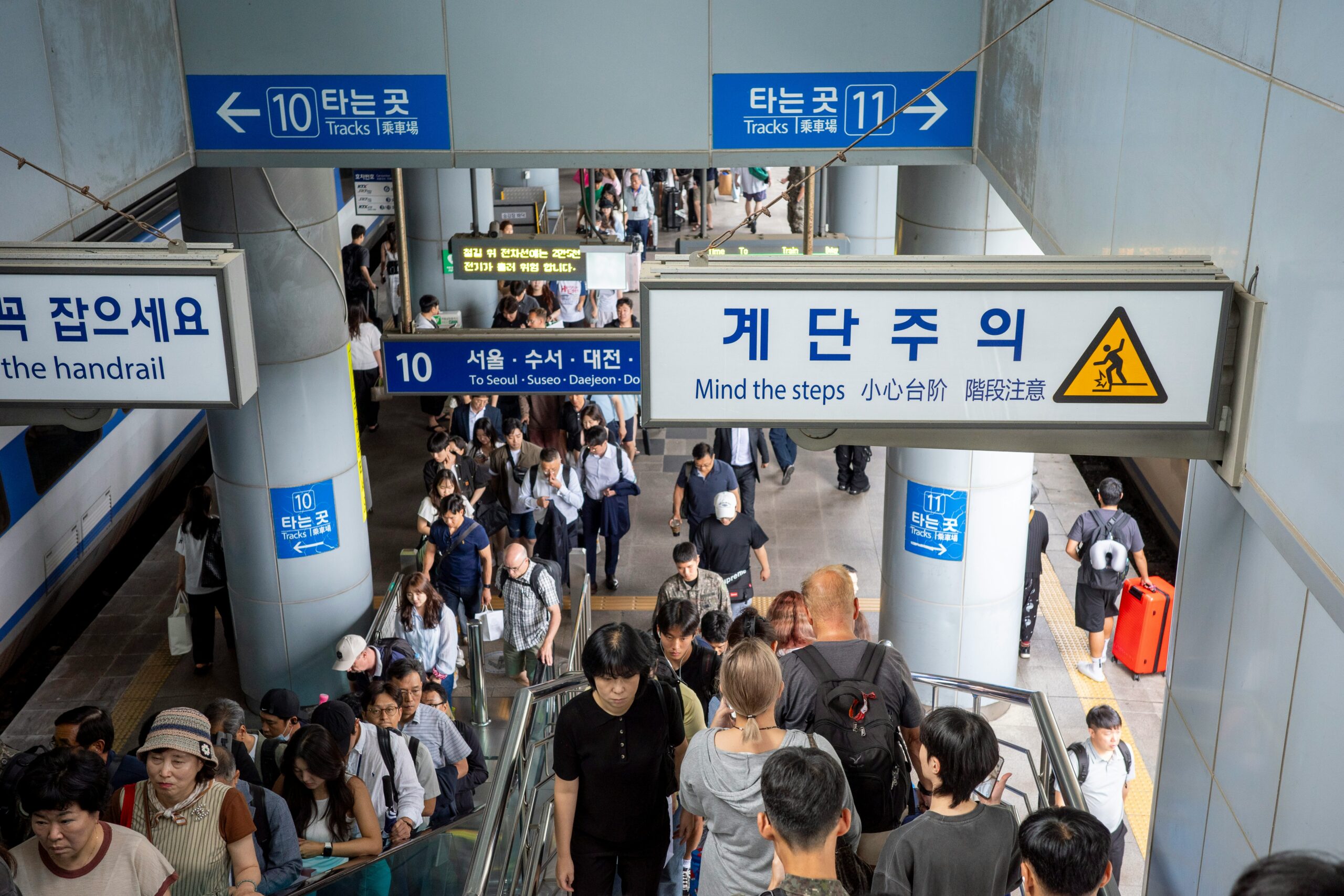 Foreigner navigating Seoul subway to reach NHIS office for insurance registration