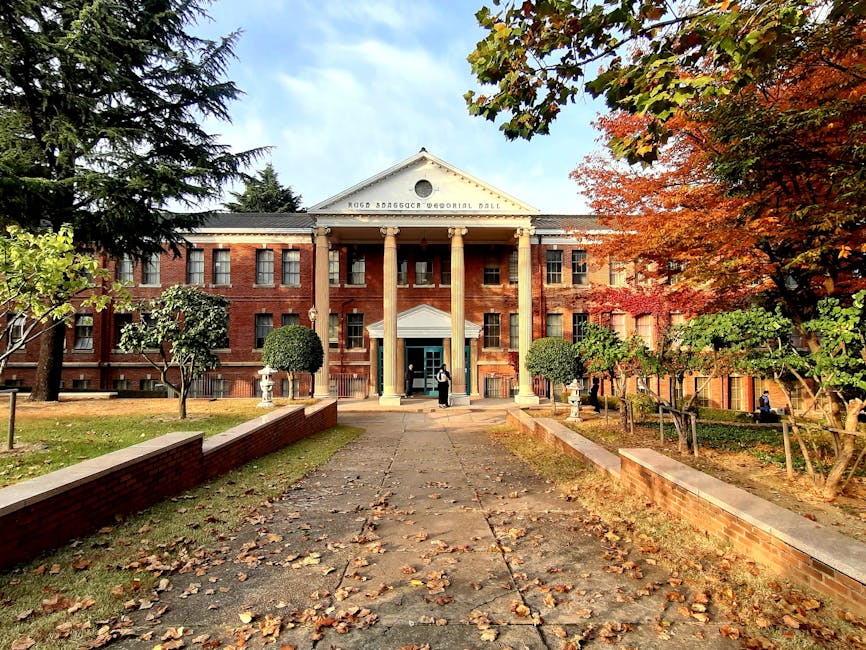 Korean university campus building surrounded by autumn foliage