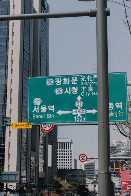 Traffic and directional signs in downtown Seoul showing road names used in Korean address system