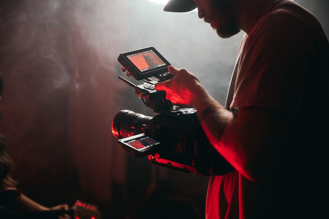 Video creator filming a production workflow with AI tools
