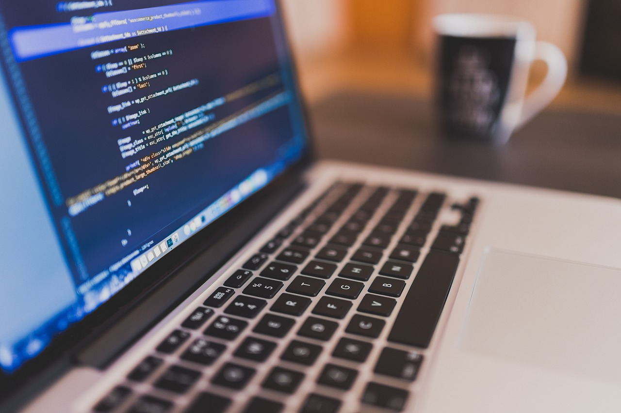 Developer desk with AI coding assistant workflow