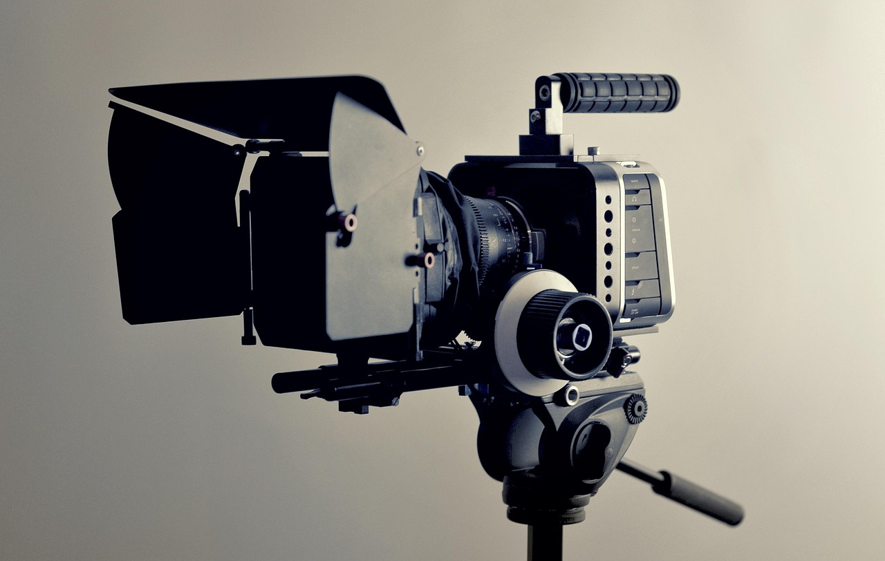 Video production team reviewing controlled motion tests for an approved shot list