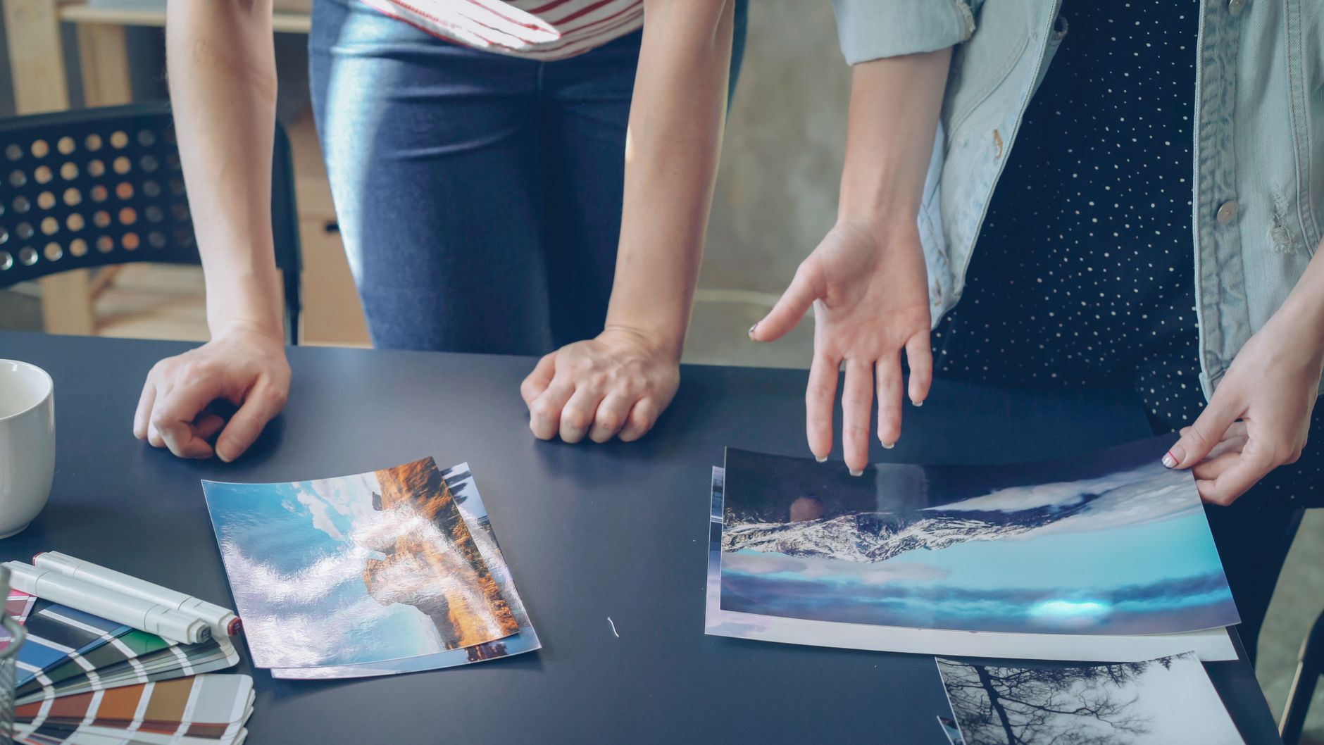 Artists reviewing character turnarounds production callouts and concept art provenance