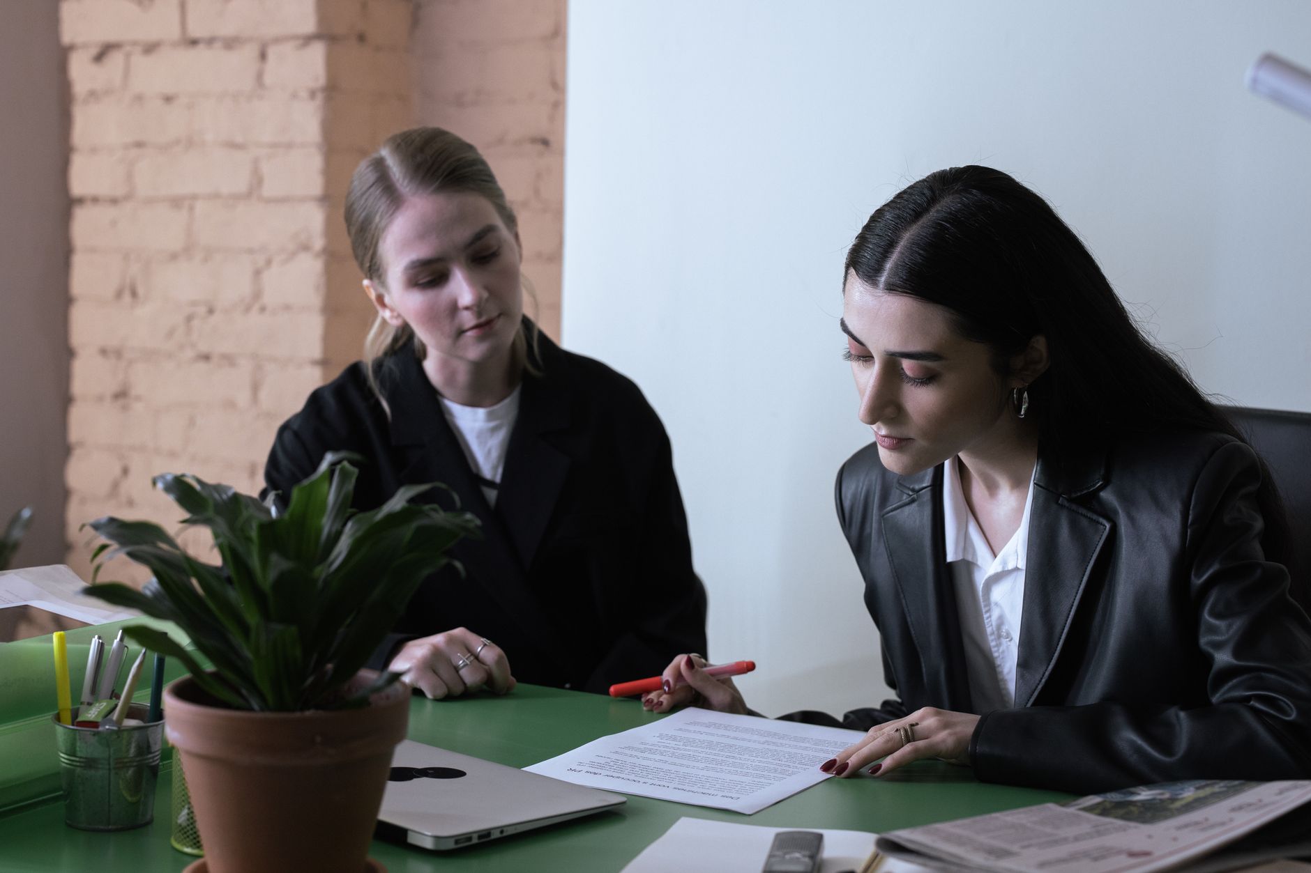 Editor and subject reviewer checking a draft before scheduled publication