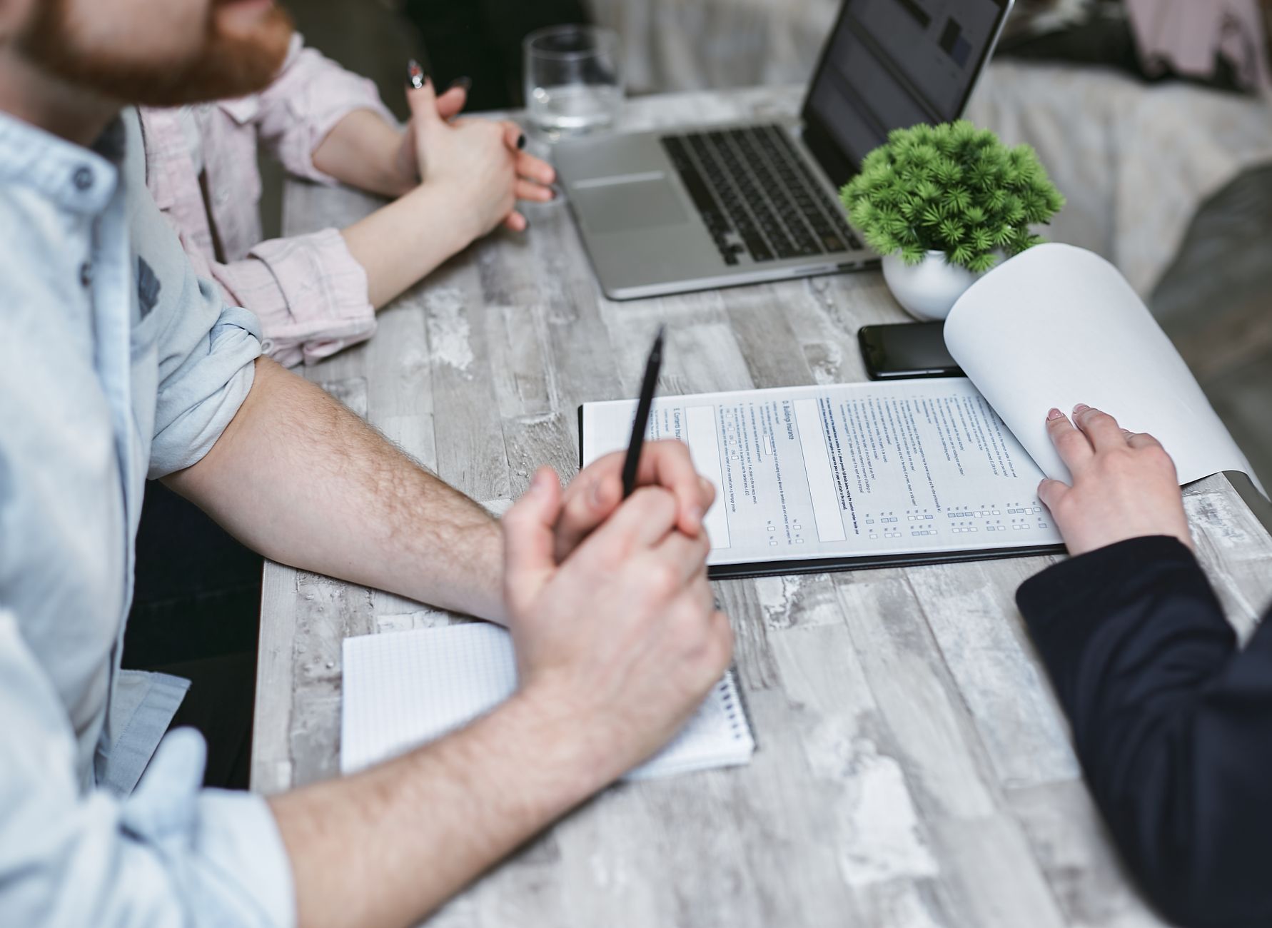 Team building an AI decision log with evidence owners review triggers and linked implementation work
